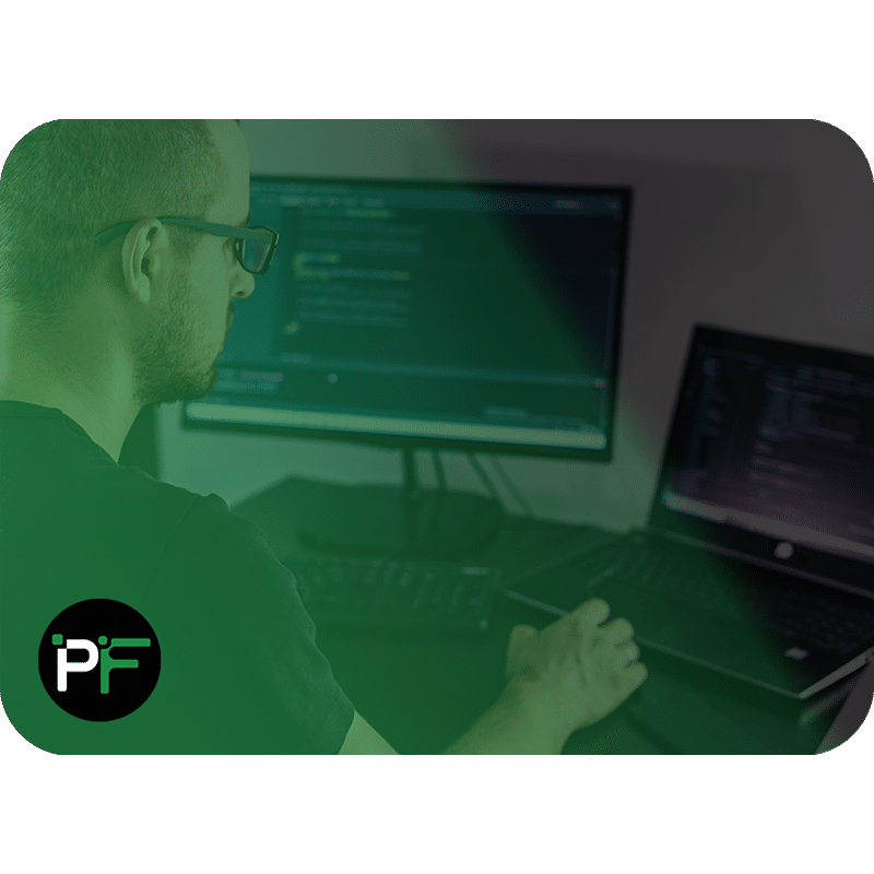 A software developer in front of his laptop with an integrated development environment open - Image for software development case study