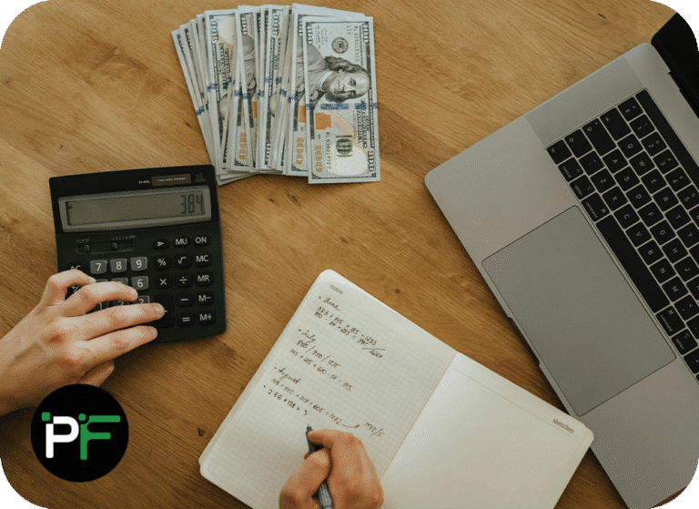 Person using a laptop and calculator to conduct their finances to demonstrate financial software development - 1000x728px