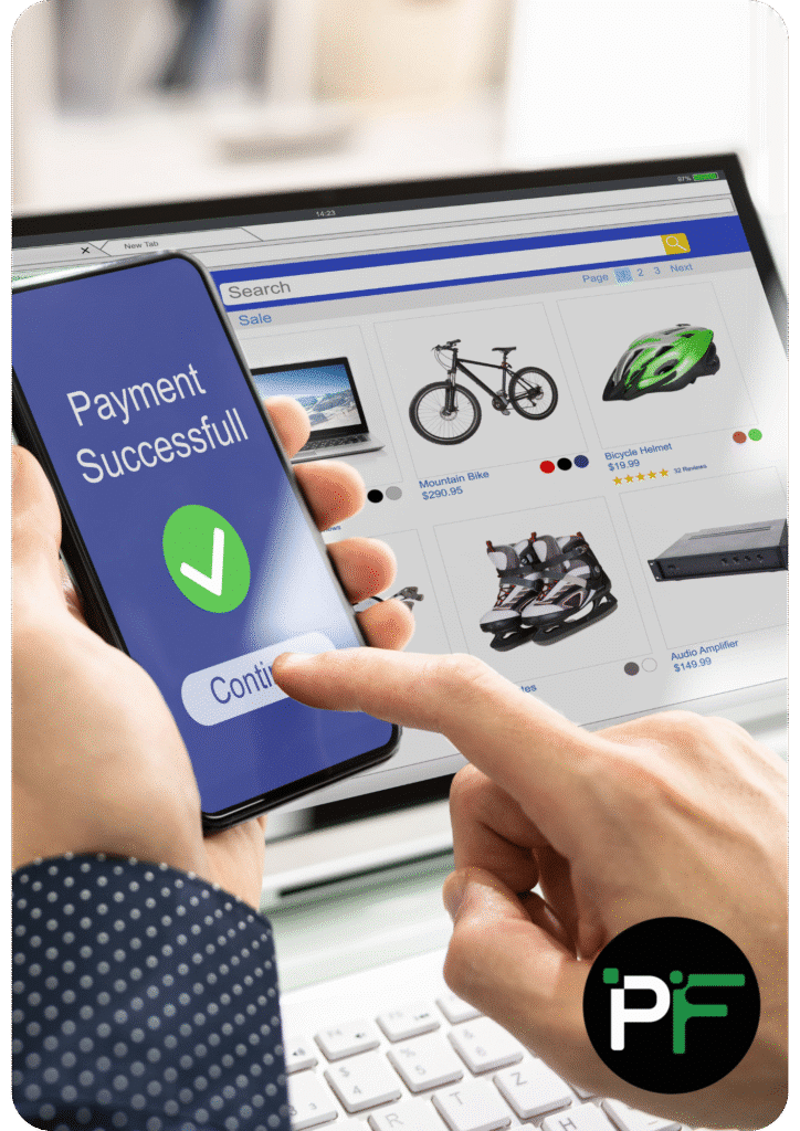 Customer purchasing an item on their laptop from an eCommerce store while a message on their phone states "Payment Successful"
